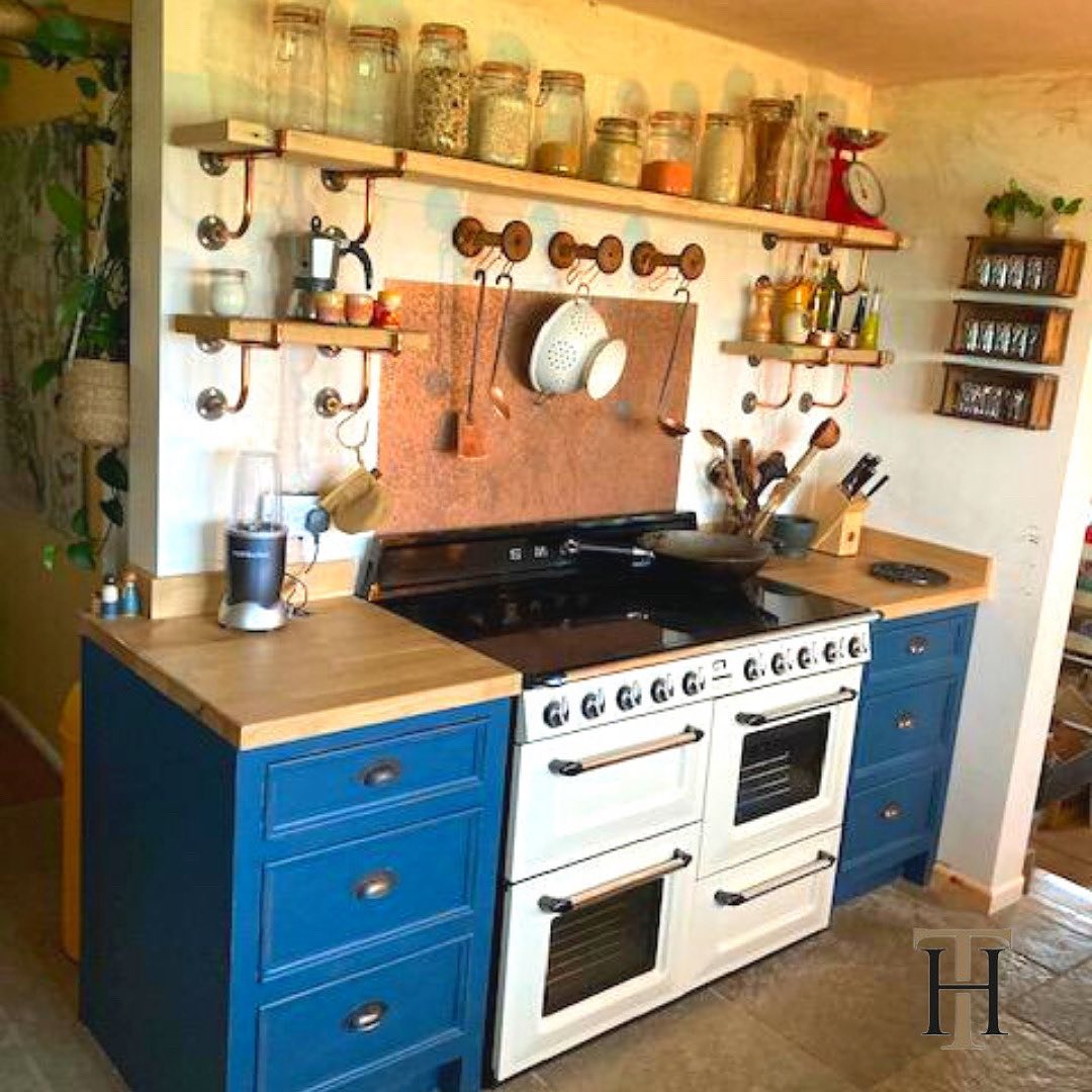 aged copper splashback in rustic kitchen