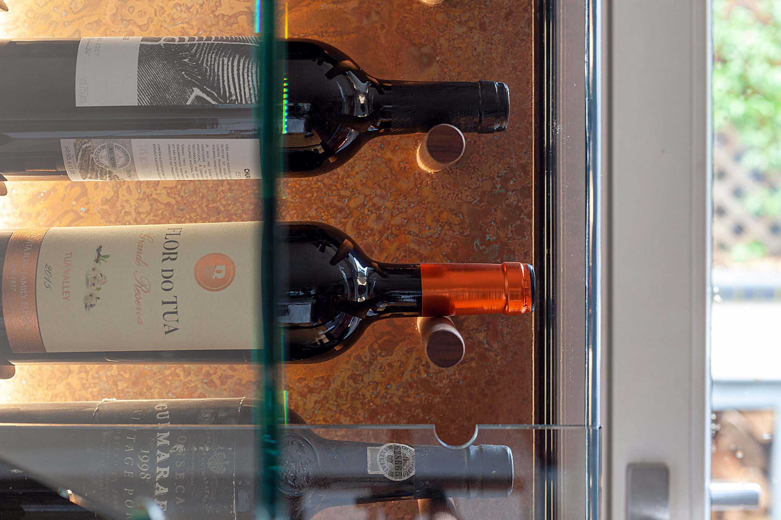 aged copper sheet used decoratively behind wine wall