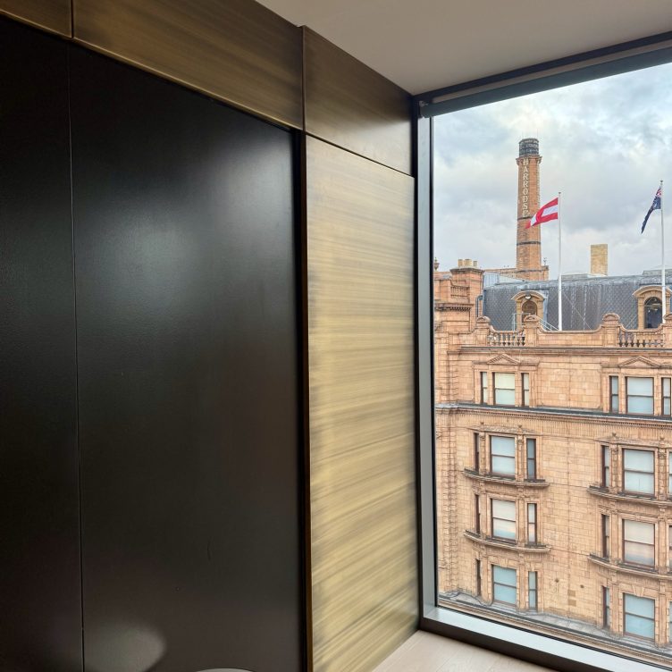 Antique brushed brass wall cladding in the Smallbone office