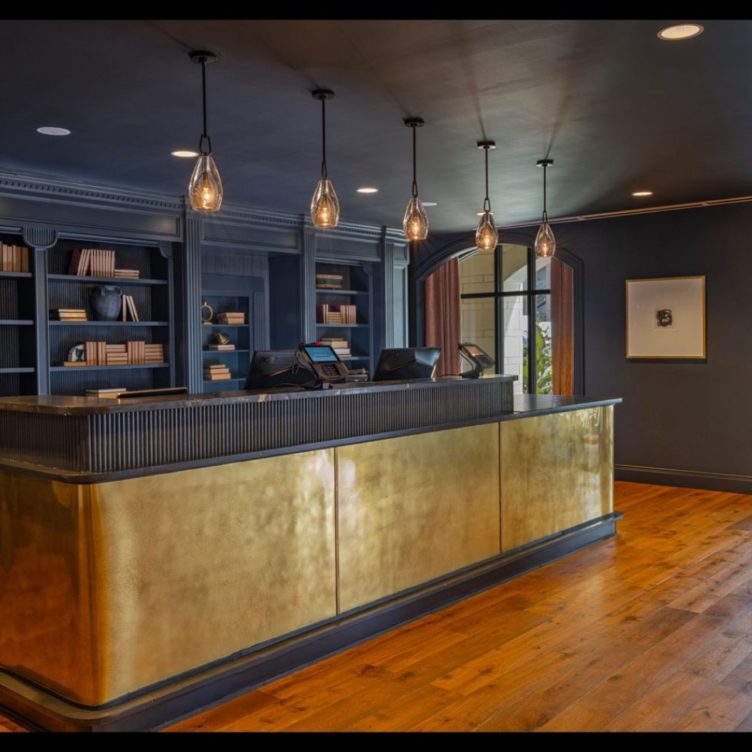 Berkshire Bronzed Brass reception desk cladding in a hotel